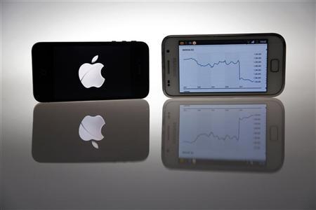 An Apple IPhone 4s and Samsung Galaxy S are seen in this illustration photo
