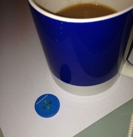 An iBeacon next to a cup of tea [Image courtesy of Exact Editions]