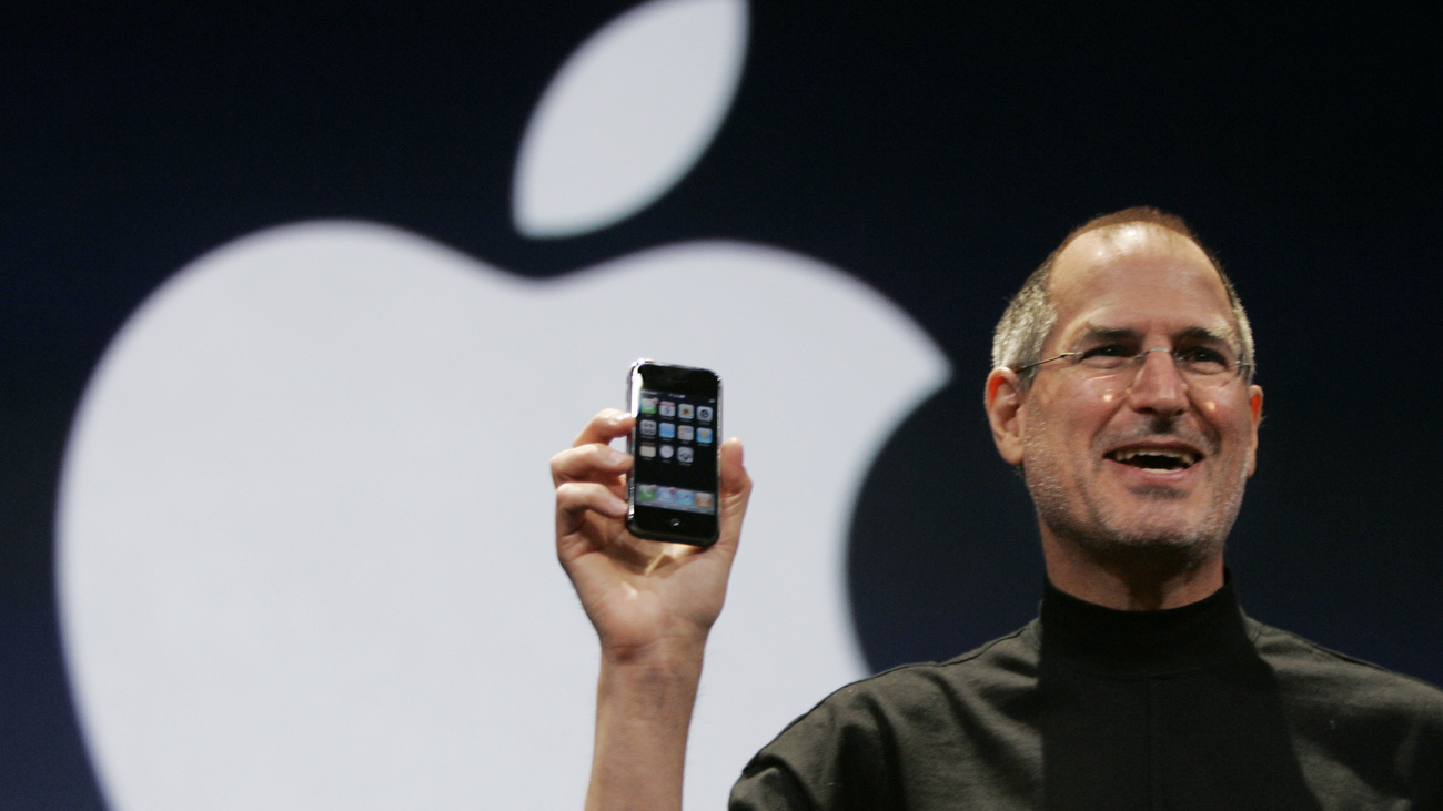 Apple CEO Steve Jobs holds up the new iPhone during his keynote address at MacWorld Conference & Expo in San Francisco, Tuesday, Jan. 9, 2007. (AP Photo/Paul Sakuma)