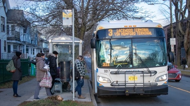 People getting on a halifax transit bus