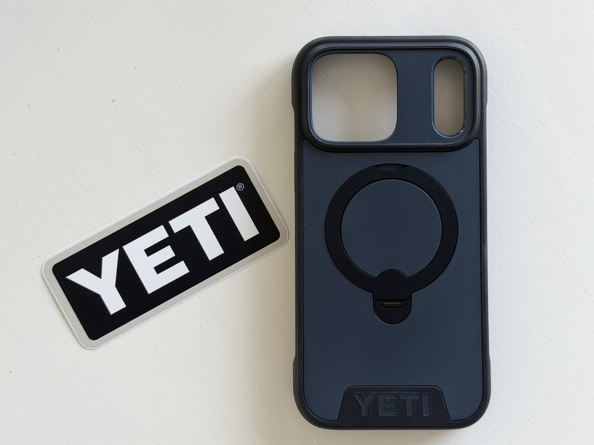 Back of the empty YETI LoadOut iPhone case with the ring stand folded flat and the YETI logo at the bottom