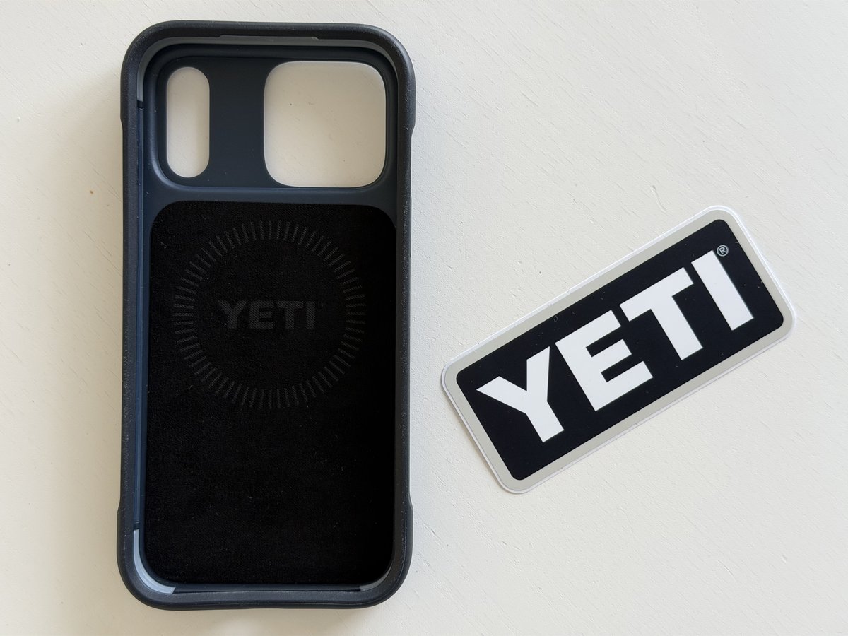 Inside of the YETI LoadOut iPhone case showing the felt lining with a YETI logo